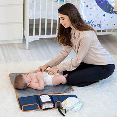 Baby changing pad on the go - with storage pockets for diapers, cream, wet wipes