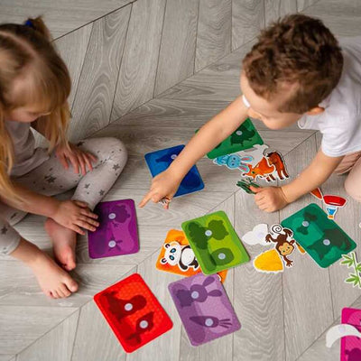 Plastic cards with velcro that facilitate creative play and imaginative thinking.